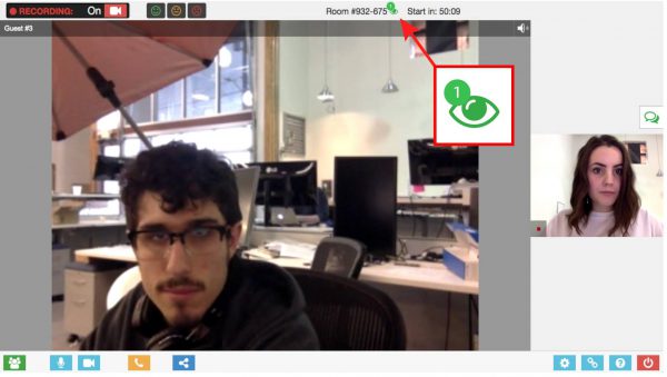 A man with glasses sits in an office in a video call. A woman is on a smaller screen in the call interface. The call is being recorded and has been active for 50:59.