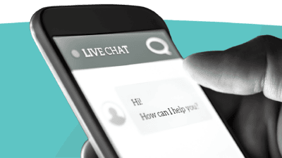 Close-up of a smartphone screen showing a live chat interface with the message, "Hi! How can I help you?" A finger is near the screen.