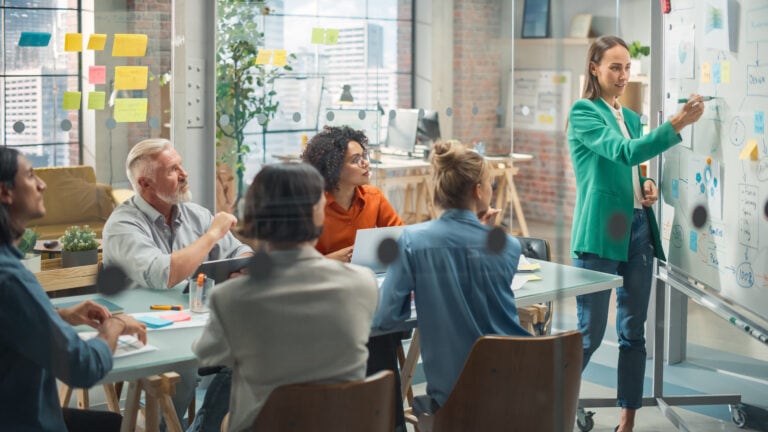 Motivated Group Having a Meeting in the Office Conference Room. Motivated Group Having a Meeting in the Office Conference Room.