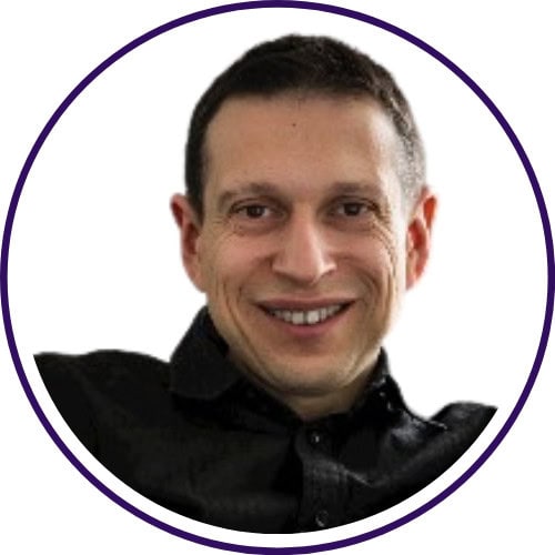 A man with short dark hair, wearing a black shirt, smiles at the camera against a white background within a circular frame, representing expertise in AI Market Research.