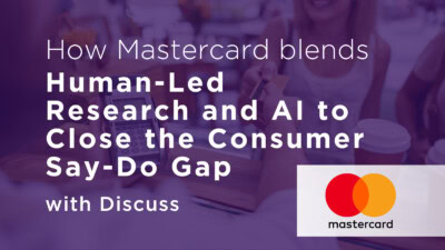 A person pays with a Mastercard at a payment terminal; overlaid text discusses Mastercard using research and AI to close the consumer say-do gap with Discuss.
