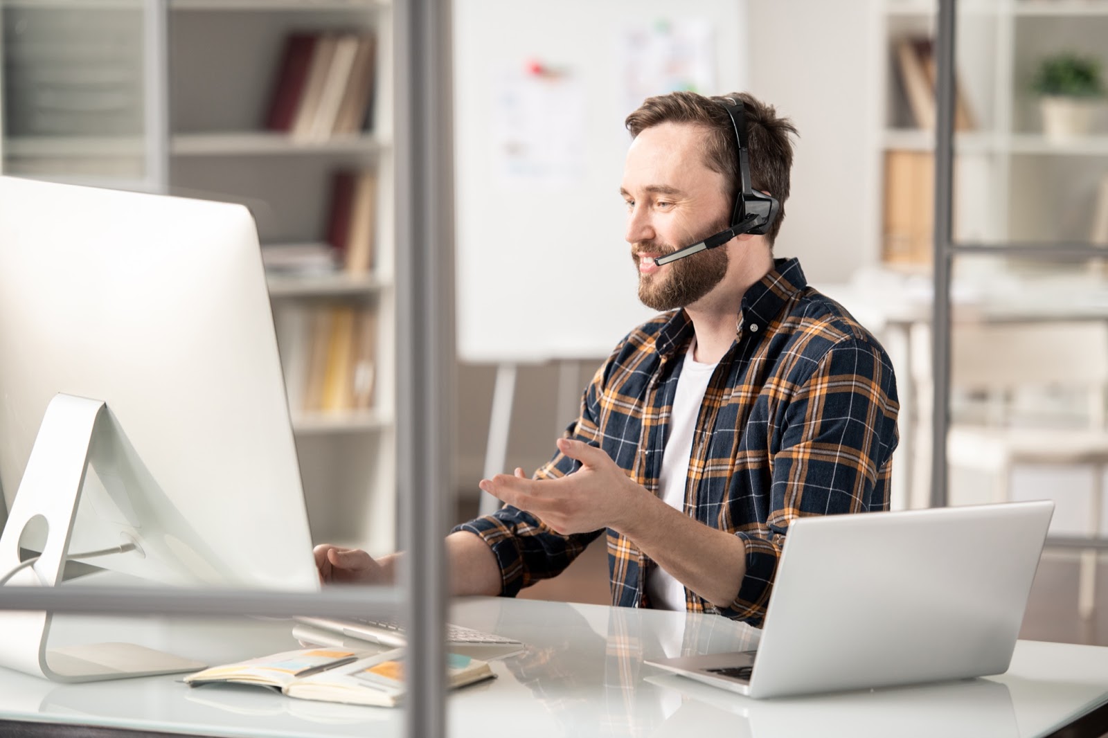 At desk with a headset